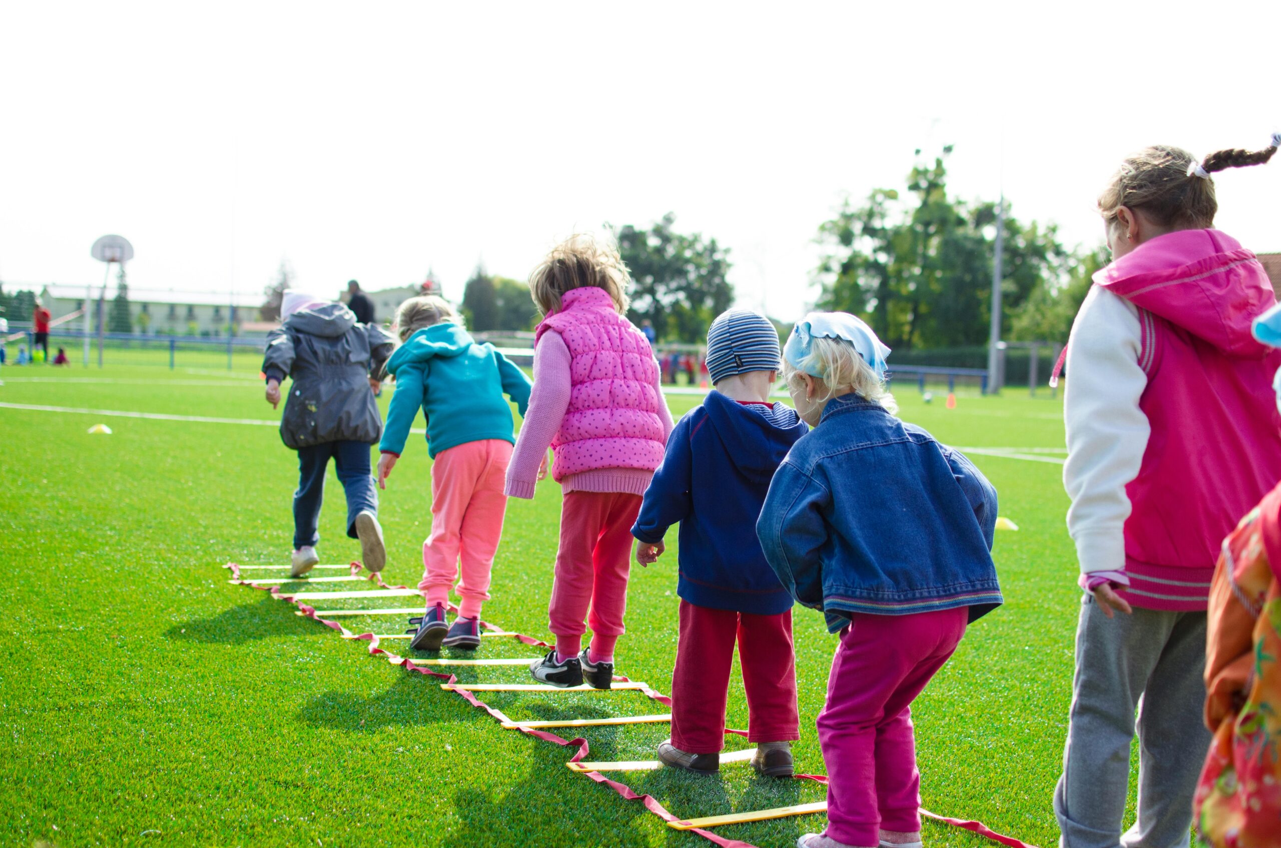 Children playing fun and educational outdoor games in a park